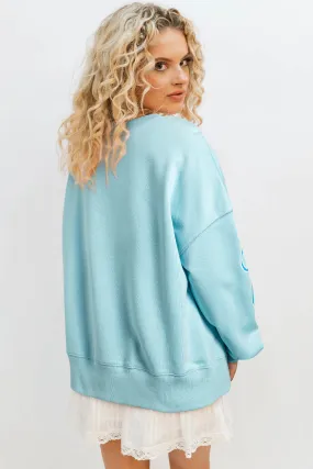 Beau Blue - Sweat-shirt surdimensionné à paillettes et nud papillon à épaules tombantes