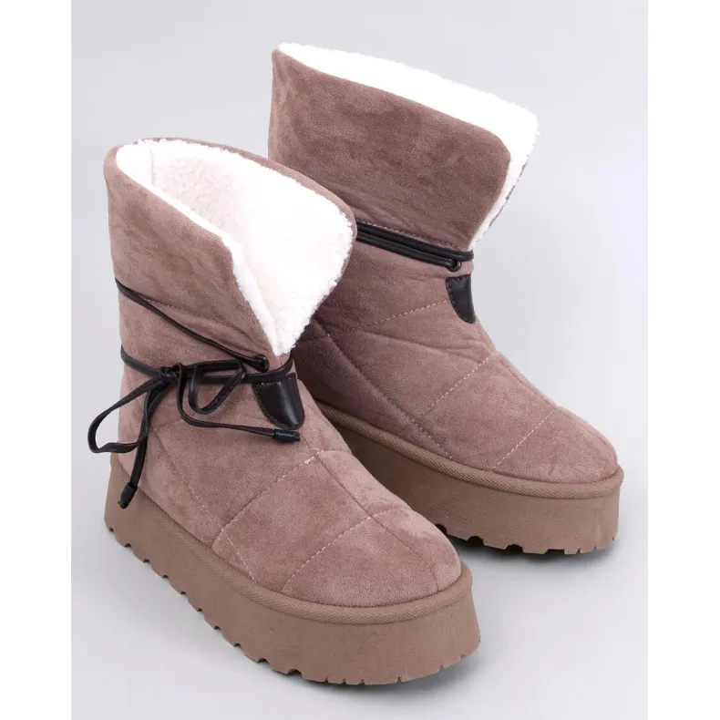 Boots de neige kaki en peau de mouton beige