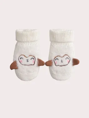 Chaussons naissance brodés en tricot