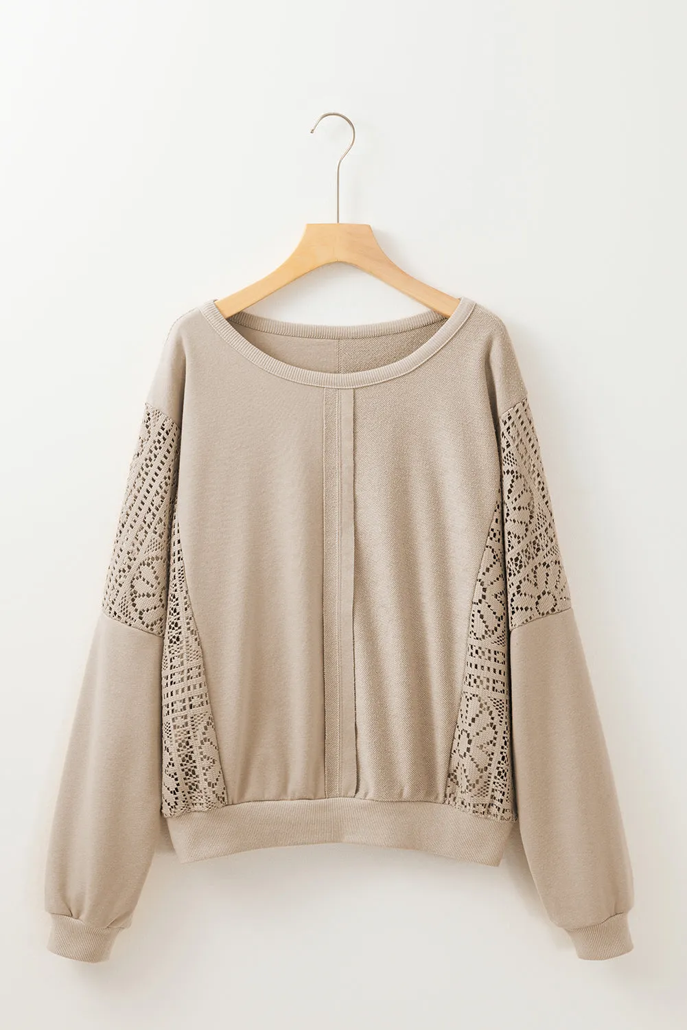 Sweat-shirt en tricot parchemin avec coutures apparentes *