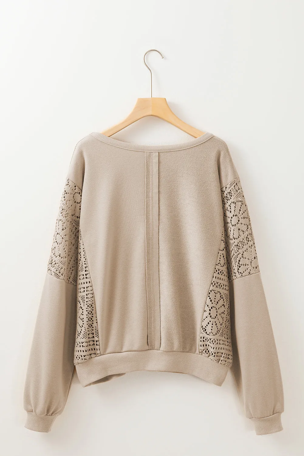 Sweat-shirt en tricot parchemin avec coutures apparentes *